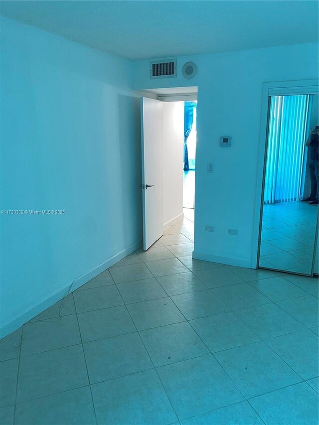 bathroom featuring toilet, tile patterned flooring, and vanity