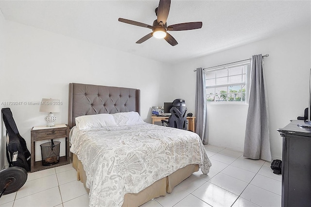 tiled bedroom featuring ceiling fan