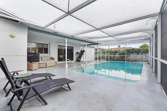 view of pool with a patio area, a lanai, outdoor lounge area, and ceiling fan