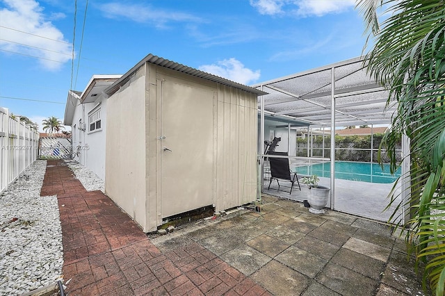 view of outdoor structure featuring a fenced in pool