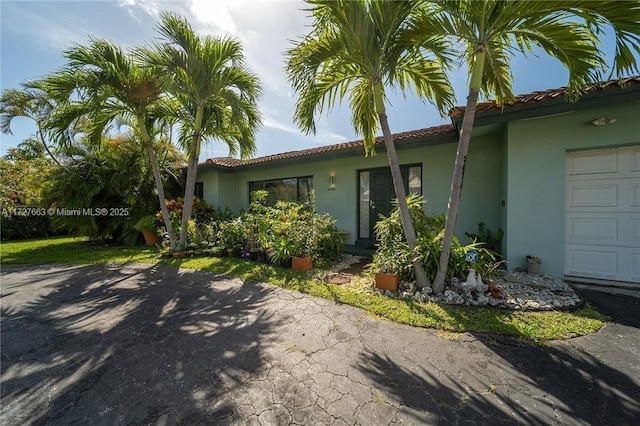 view of side of home with a garage