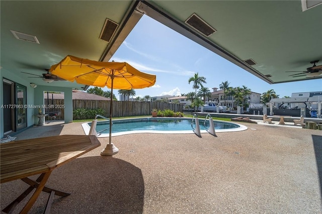 view of pool with a patio and ceiling fan