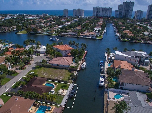 birds eye view of property with a water view