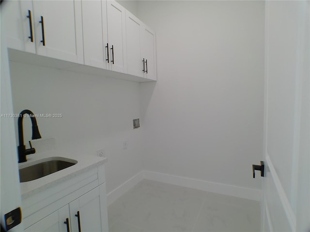 laundry room with sink, cabinets, and washer hookup