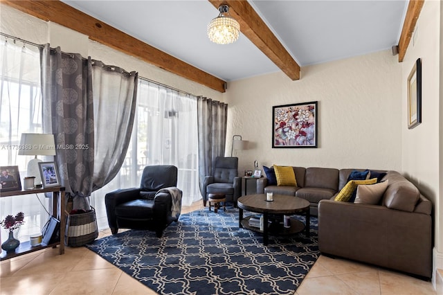 tiled living room featuring an inviting chandelier and beam ceiling