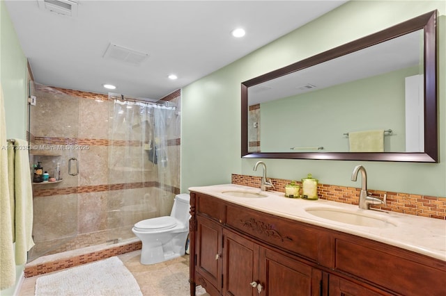 bathroom with tasteful backsplash, vanity, toilet, and a shower with shower curtain