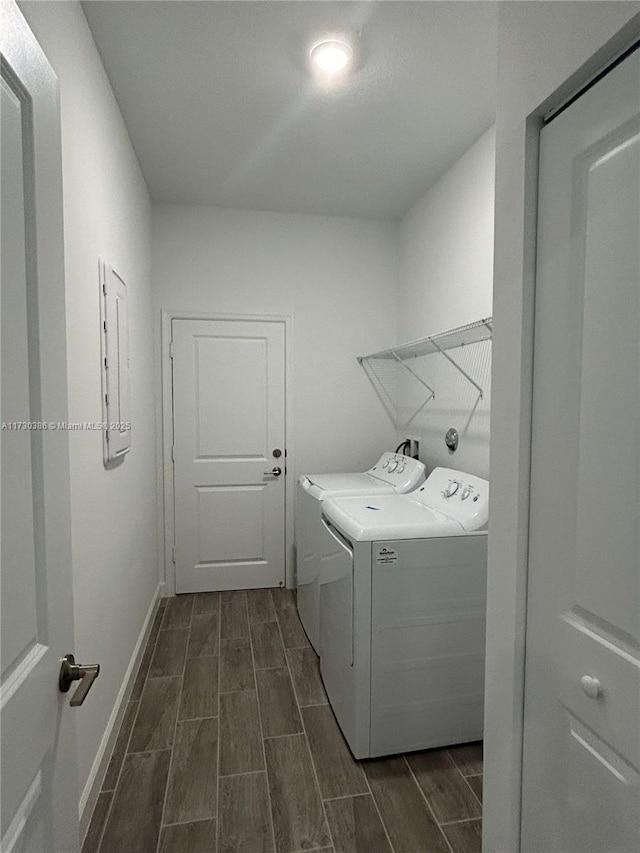 laundry area featuring electric panel and washing machine and dryer