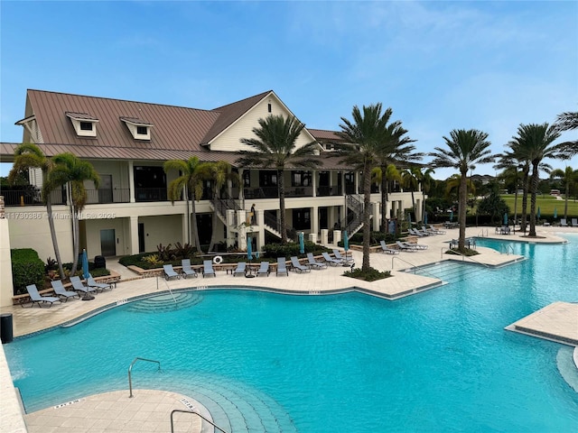 view of swimming pool with a patio area