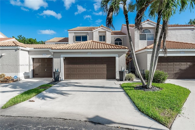 mediterranean / spanish-style home featuring a garage