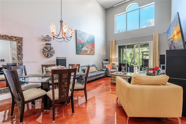 dining room with a high ceiling and an inviting chandelier