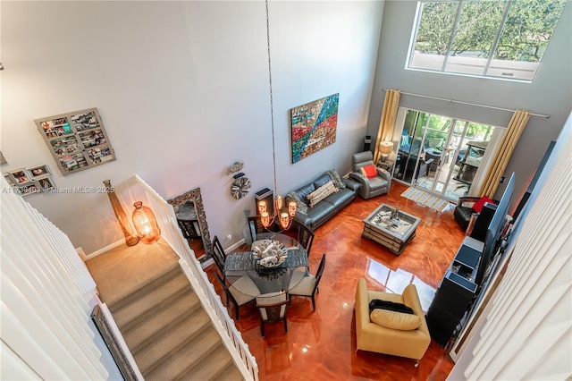 living room with a high ceiling