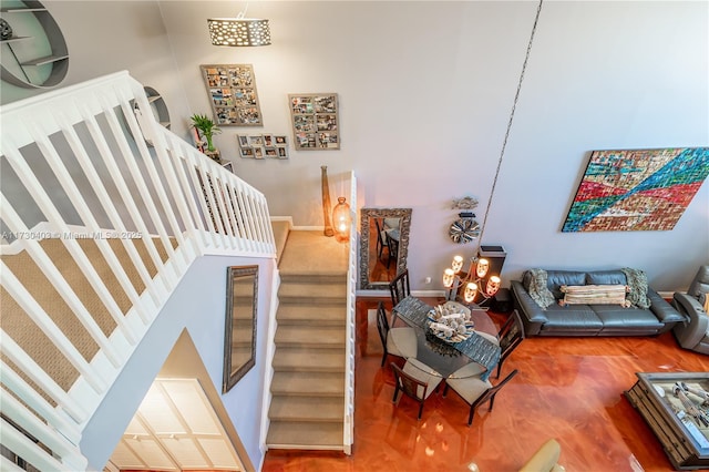 staircase with a high ceiling