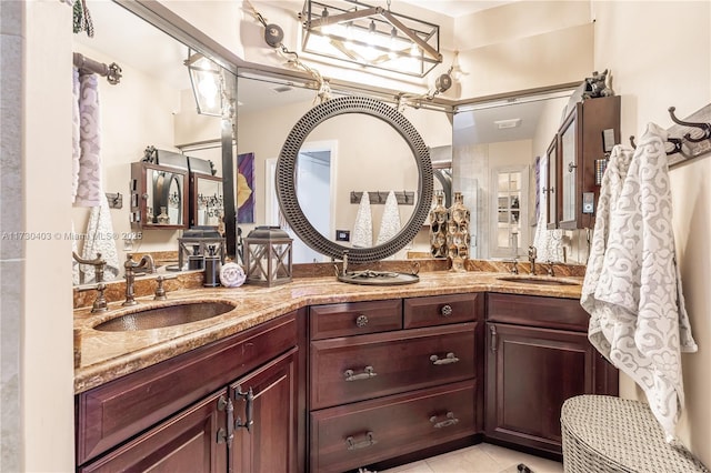 bathroom with vanity and tile patterned flooring