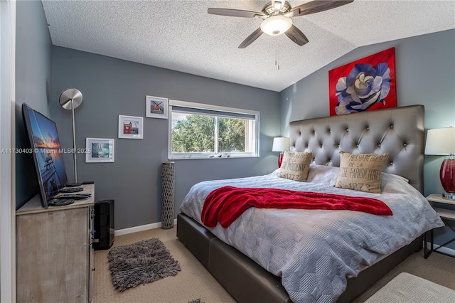 carpeted bedroom with ceiling fan, a textured ceiling, and lofted ceiling