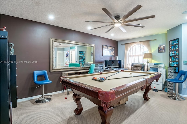 playroom featuring light carpet, ceiling fan, and a textured ceiling