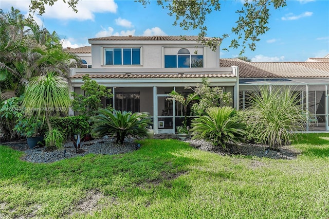 rear view of house with a lawn