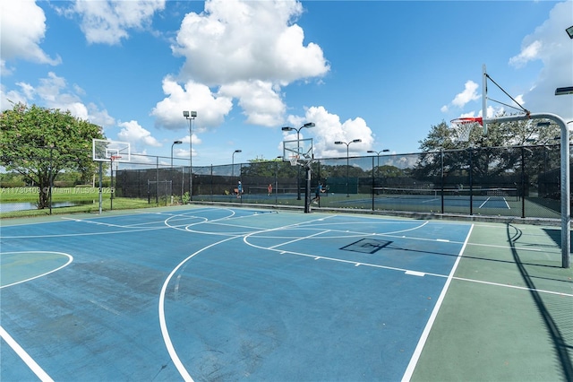 view of sport court featuring tennis court