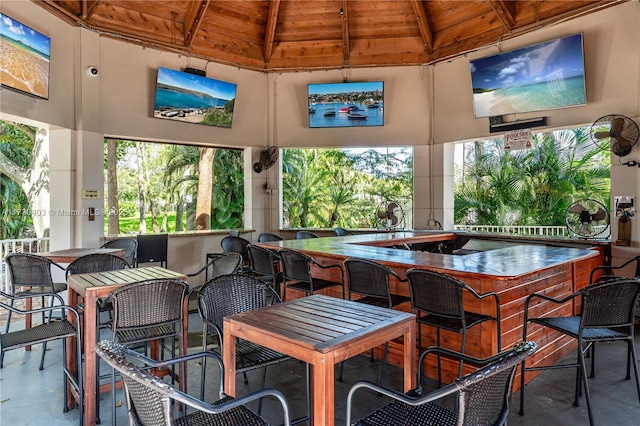 view of patio with an outdoor bar and a gazebo