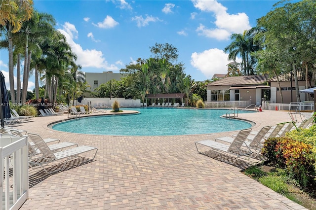 view of swimming pool with a patio area