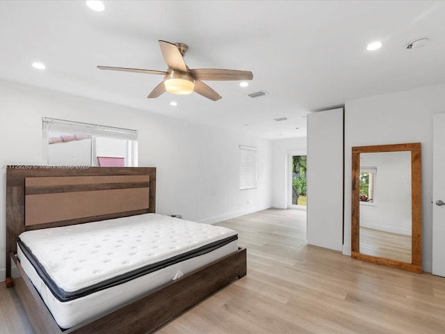 bedroom with light wood-type flooring and ceiling fan