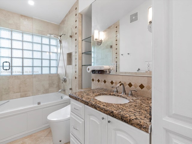 full bathroom with tub / shower combination, tile patterned flooring, vanity, tasteful backsplash, and toilet