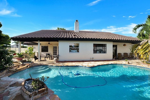 view of pool featuring a patio and ceiling fan