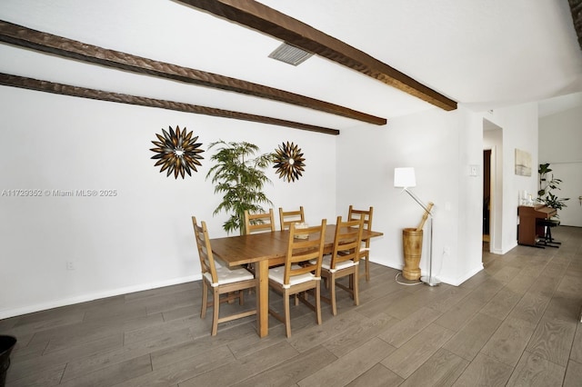 dining room featuring beam ceiling