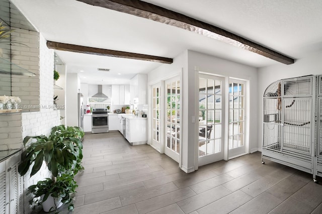 interior space featuring beamed ceiling