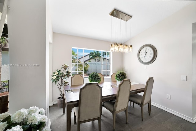 dining space featuring dark wood-type flooring