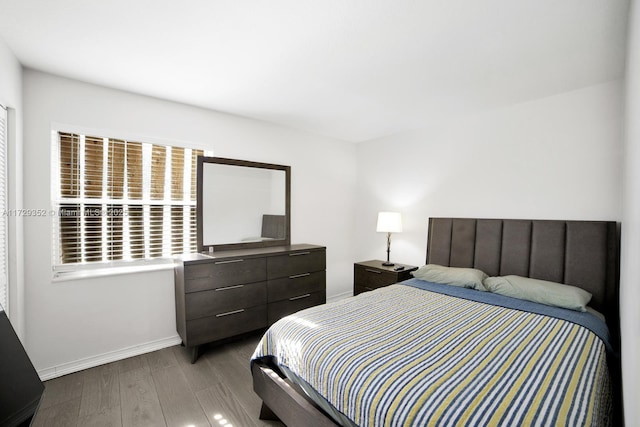 bedroom featuring wood-type flooring