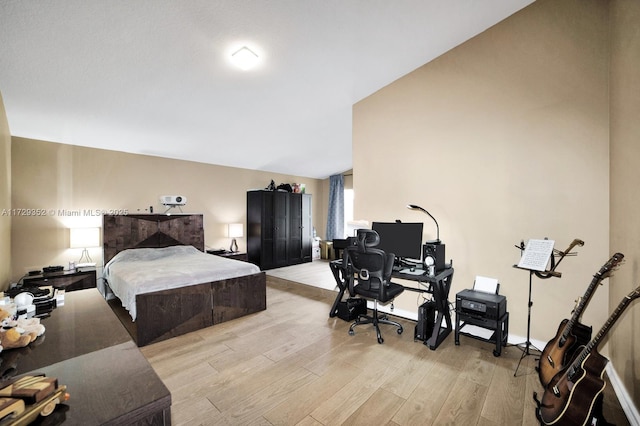 bedroom with light hardwood / wood-style floors