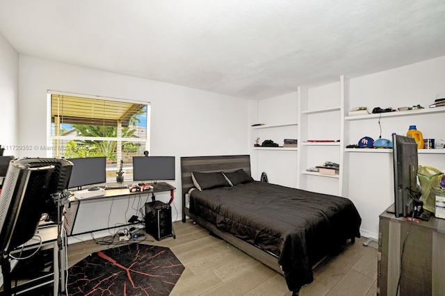 bedroom with light wood-type flooring