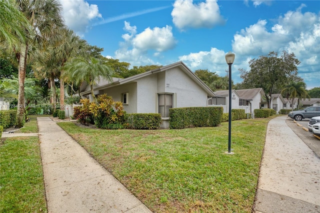 view of property exterior featuring a lawn