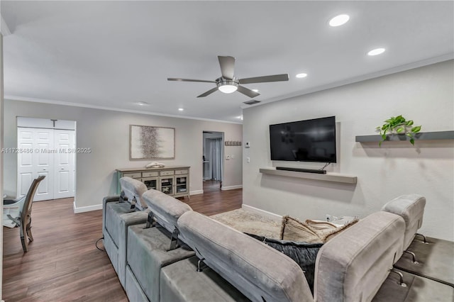 living room with ceiling fan, dark hardwood / wood-style flooring, and ornamental molding