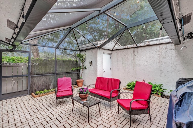 view of patio with a lanai