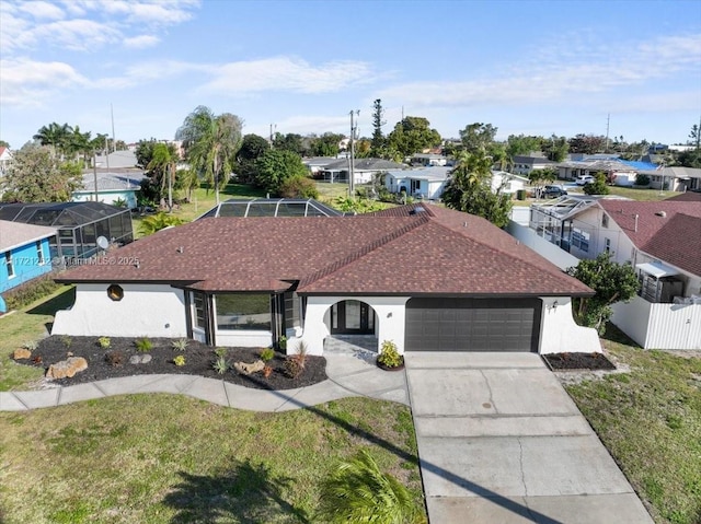 ranch-style house with a front yard, a lanai, and a garage