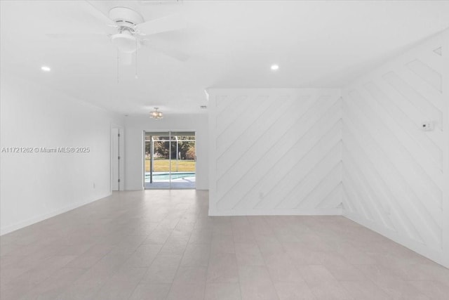 unfurnished room with ceiling fan