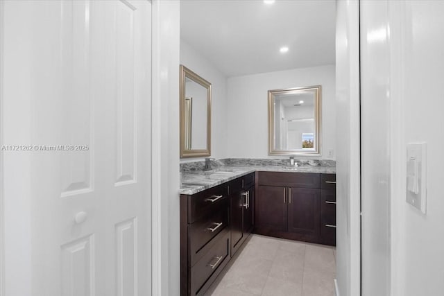 bathroom featuring vanity and tile patterned flooring