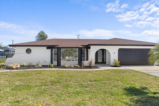 single story home with a garage and a front yard