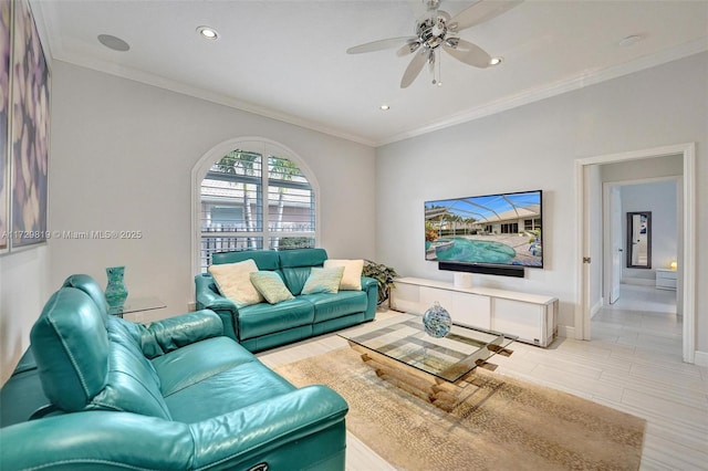 living room with crown molding and ceiling fan