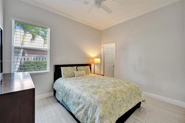 bedroom featuring ornamental molding and ceiling fan