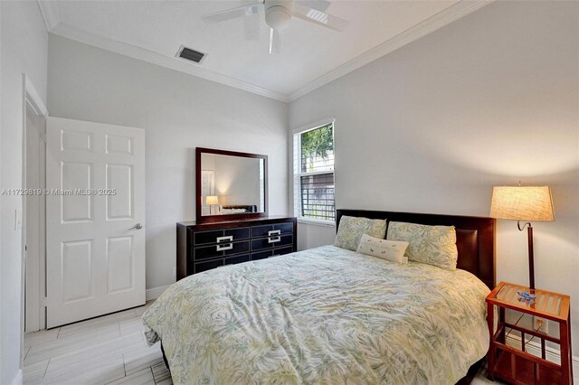 bedroom with crown molding and ceiling fan