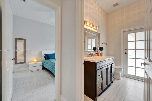 bathroom with vanity and toilet