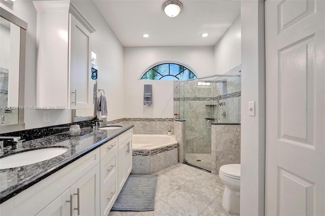 full bathroom with vanity, plus walk in shower, and toilet