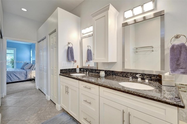 bathroom with vanity and tile patterned floors