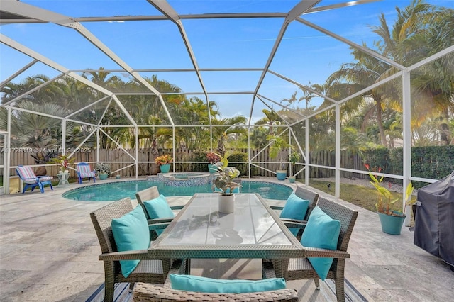 view of patio / terrace featuring a swimming pool with hot tub and glass enclosure