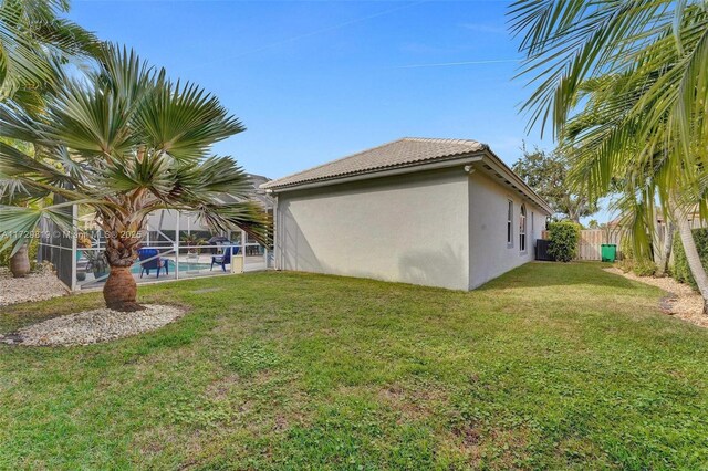 view of yard with a fenced in pool