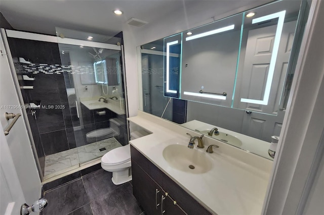 bathroom with vanity, toilet, and walk in shower