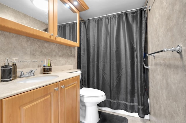 bathroom featuring toilet and vanity