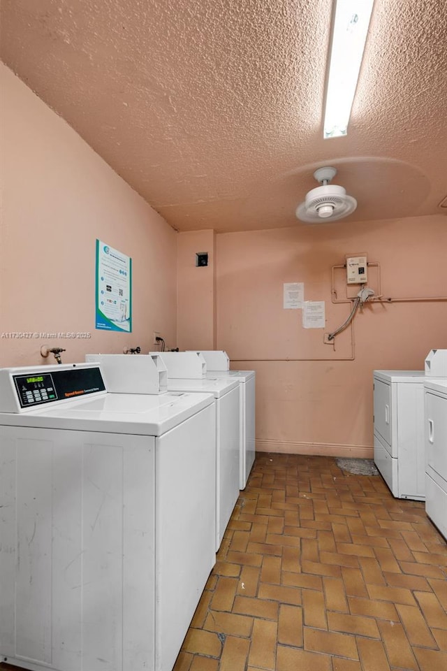 clothes washing area featuring washer and dryer